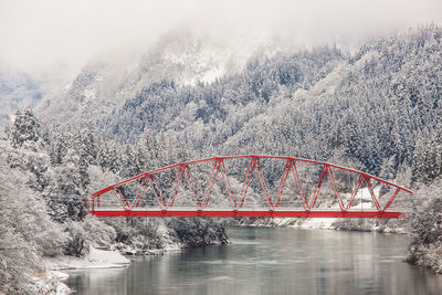 View of bridge over river during winter