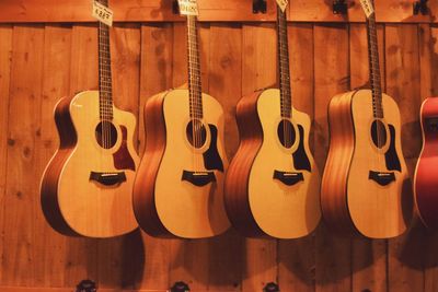 Guitars hanging against wall at store