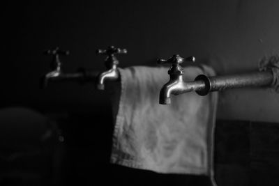 Close-up of faucet against wall at home