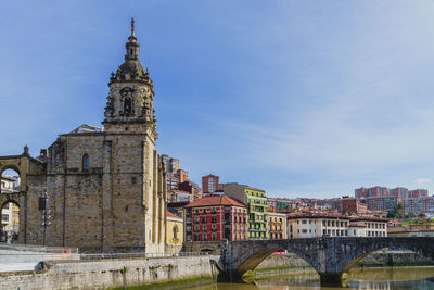 Buildings in city against sky