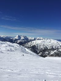 Scenic view of mountains against sky during winter