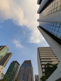 Low angle view of modern buildings against sky in city