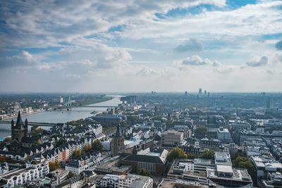 Aerial view of cityscape against sky