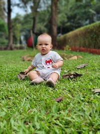 Low section of woman standing by plants