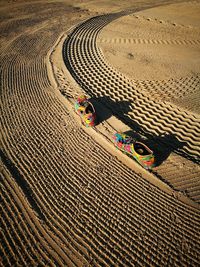 High angle view of shadow on sand at beach