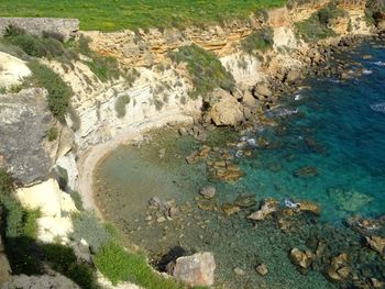 High angle view of rock formation in sea