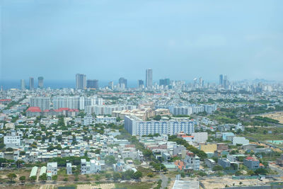 High angle view of buildings in city against sky