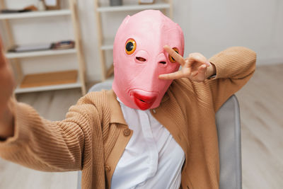 Midsection of woman wearing mask