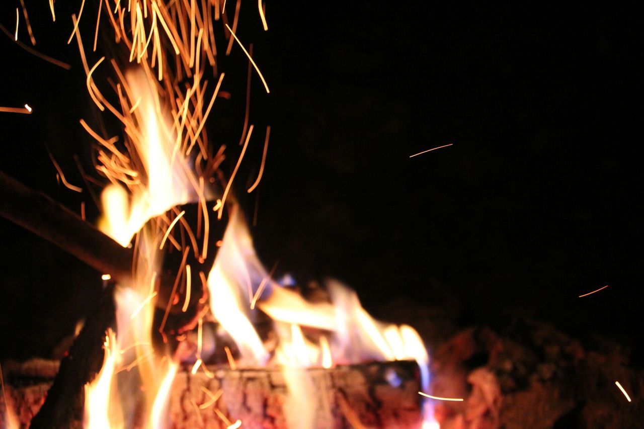 burning, fire - natural phenomenon, night, flame, heat - temperature, illuminated, glowing, bonfire, fire, motion, long exposure, light - natural phenomenon, campfire, celebration, sparks, firewood, heat, dark, firework - man made object, blurred motion