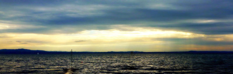 Scenic view of sea against dramatic sky
