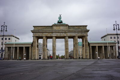 View of brandenburg gate against cloudy sky