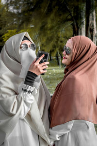 Side view of woman wearing sunglasses