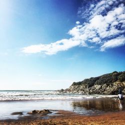 Scenic view of sea against cloudy sky