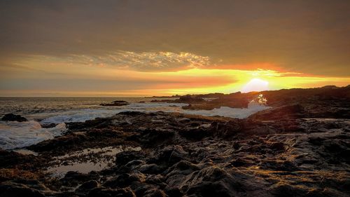 Scenic view of sea at sunset