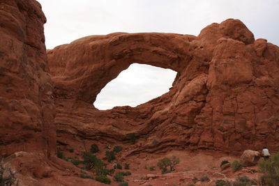 Low angle view of rock formations against sky at arches national park