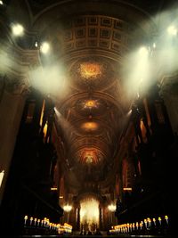 Low angle view of illuminated ceiling at night