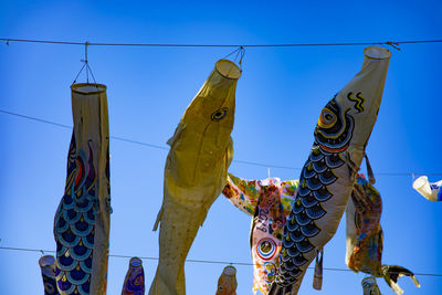 Low angle view of clothes drying on rope