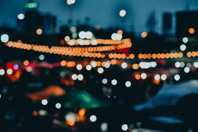 Defocused image of illuminated lights at night