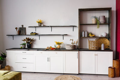 Scandinavian-style kitchen interior in white and brown colors