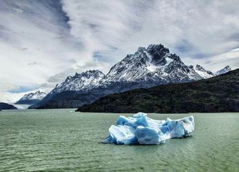 Scenic view of snow covered mountain against sky