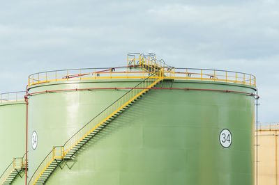 Low angle view of factory against sky