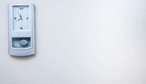 Clock on white wall