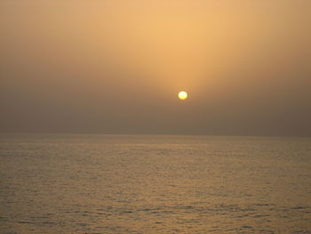 Scenic view of sea against clear sky during sunset