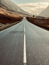 Empty road amidst mountain