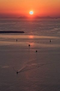 Scenic view of sea against orange sky