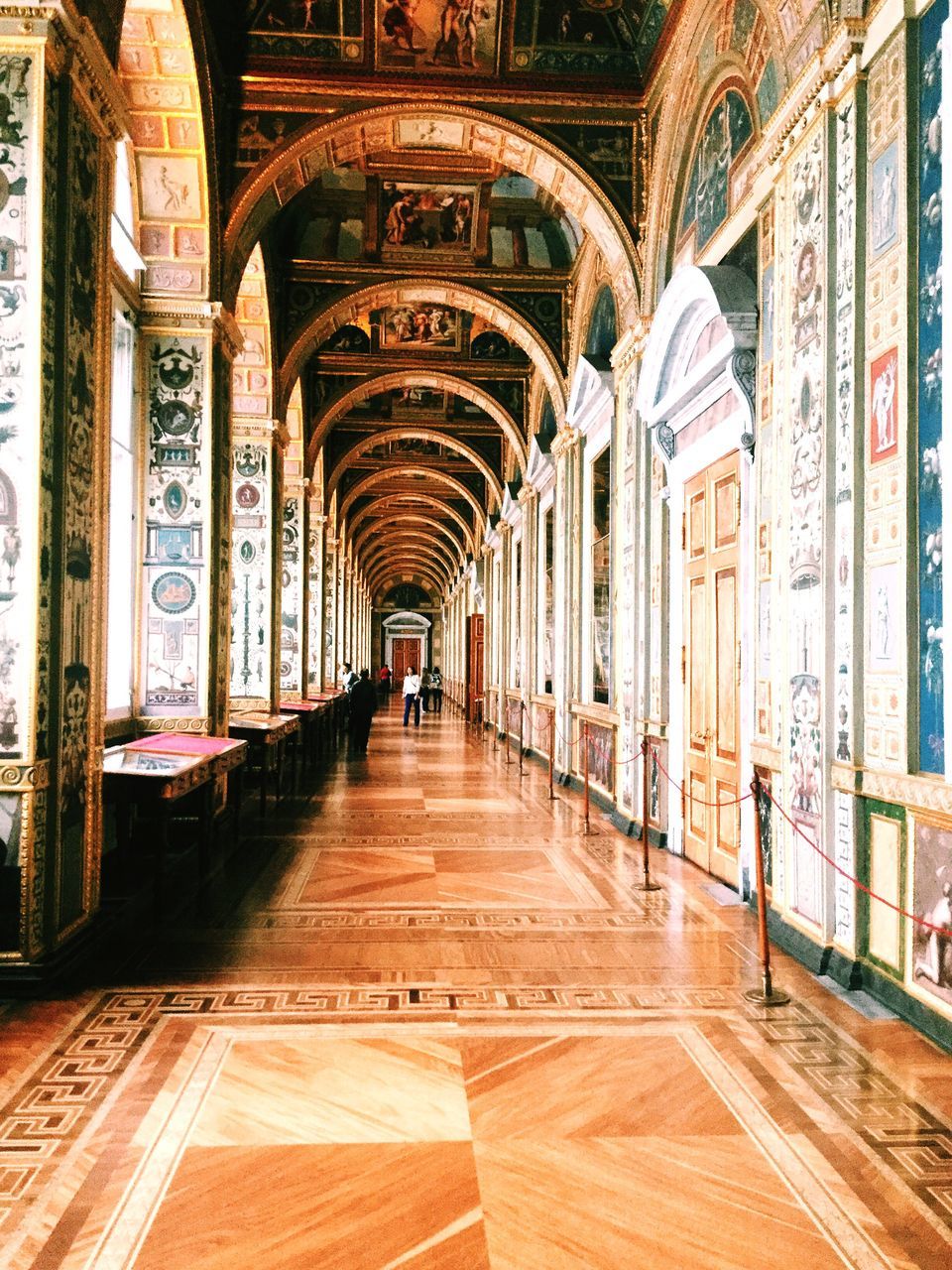 indoors, architecture, built structure, arch, the way forward, corridor, diminishing perspective, ceiling, architectural column, empty, flooring, incidental people, interior, history, colonnade, building, building exterior, vanishing point, in a row, archway