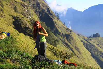 Full length of man standing on mountain
