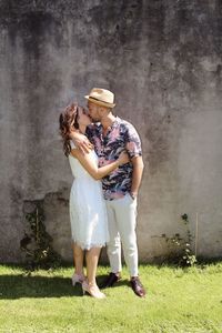 Full length of woman standing in grass