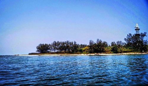 Scenic view of calm sea against clear sky