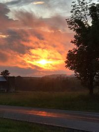 Scenic view of field against sky during sunset