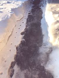 High angle view of surf on beach