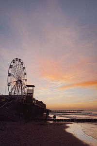 Scenic view of beach against sky during sunset