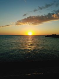 Scenic view of sea against romantic sky at sunset