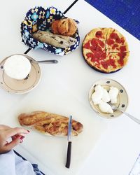 Close-up of hand holding food on table