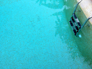 Close-up of ladder in swimming pool