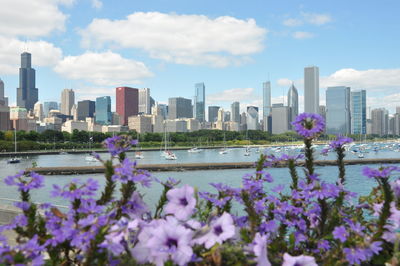 View of cityscape against cloudy sky