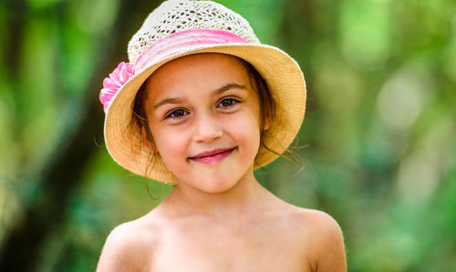Close-up portrait of shirtless girl