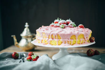 Close-up of fruitcake on stand