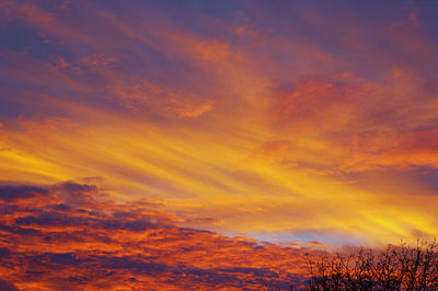 Low angle view of dramatic sky during sunset