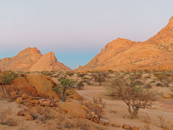 Scenic view of arid landscape against sky