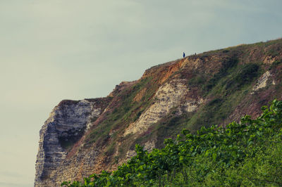 Low angle view of rock formations against sky