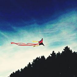 Low angle view of airplane flying in sky