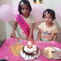 Cute girl with balloons at home