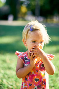 Portrait of cute girl in land