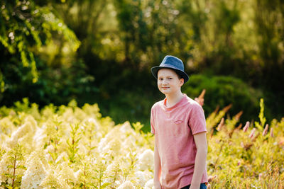 Boy standing on field