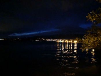 Scenic view of sea against sky at night